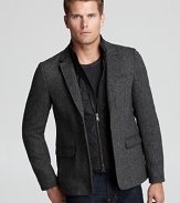 A trend-right look with a removable faux vest panel, this dapper sport coat hits the mark in classic herringbone.