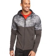 Look fly in this camo top hoodie by Nike with reflective strips to get you noticed.