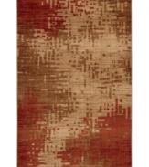 An artful arrangement of red tones gives this Mohawk area rug an almost pixelated quality, adding a point of interest to any floor. Woven from durable olefin yarn that ensures a thick pile and super-soft hand.