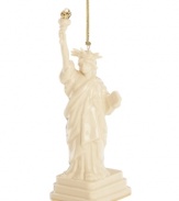 As statuesque as her inspiration, the Lady Liberty ornament welcomes guests to gather 'round. Her gold torch is radiant atop ivory porcelain with the esteemed craftsmanship of Lenox.