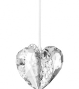 Silvertone metal pierced with intricate patterns and sparkling chatons adds even more splendor to this exquisite Swarovski crystal heart ornament.