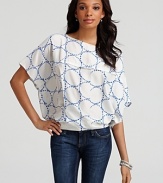 An oceanic geometric-print lends tranquility to this silk DIANE von FURSRENBERG top, a luxurious pairing for off-duty denim. For workdays and weekends alike, the piece is best accented with an armful of silver bangles for a touch of shimmering glam.