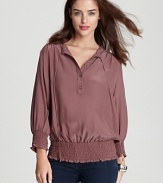 It's all in the details with this Akiko silk top, featuring smocking, buttons and ties at the neck.