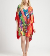 Vivid colors swirl on this flowing animal-inspired design of silky-smooth material. V-neckThree-quarter length dolman sleevesAbout 36 from shoulder to hemPolyesterMachine washImported