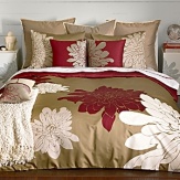 Defying standard repeat patterns, signature chrysanthemums are rendered in a stunning scale across the entire surface of the set. Crisp pure white and bright lacquer red bloom against a warm grey ground and reverses to lacquer red. Matching pillow shams feature a double flange. Set includes duvet cover and two shams; Twin set includes one sham. Duvet cover features button closure; Shams feature envelope closure.