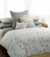 Serenity now. Create a calm atmosphere of luxury with the Quince duvet from Calvin Klein. A watercolor print of stone and green florals adorns this ultra-soft comforter in 100% pure combed cotton percale, evoking the essence of natural beauty with a purely modern allure. Self reversing. (Clearance)