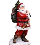 Rose-cheeked and with a joyful smile upon his face, Santa creates a festive holiday mood with his bag of toys slung over his shoulder in preparation for a long night of delivering gifts.