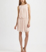 Crisp, narrow pleats and a prettily scalloped hemline define this feminine design.Jewel necklineBeaded shoulder detailsSleevelessSmooth yokeBlouson bodiceElastic waistAllover front pleatsScalloped hemlineFully linedBack zipAbout 15 from natural waistPolyesterDry cleanImportedModel shown is 5'9½ (176cm) wearing US size 4. 