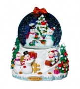 When it comes to snow, the more the merrier. A happy family gathers around this festive snow globe, sledding down a hill and decorating a tree. With shimmering glitter from top to bottom, it's a surefire favorite from Christopher Radko.