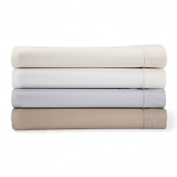 Classic combed cotton percale in a soothing spectrum of modern hues, these versatile Calvin Klein Home fitted sheets boast a sleek corded hem detail.