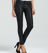 A slick coated wash adds tough-girl allure to these DL1961 legging jeans.