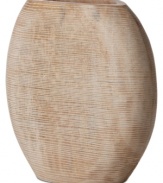 At once modern and organic in nature, the Light Carved vase is sculpted and carved by hand in honey-colored mango wood to achieve a distinct artisan feel. A uniquely bold statement by Donna Karan Lenox.