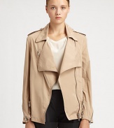 An unexpected approach to the biker jacket, this polyester and cotton design has trenchcoat-inspired details and a draped front. Notched collarDraped frontEpauletsAsymmetrical front zipperLong sleeves with zippered cuffsBack rain flapAbout 26 from shoulder to hemPolyester/cottonDry cleanImported of Italian fabricSIZE & FITModel shown is 5'10 (177cm) wearing US size 4. 