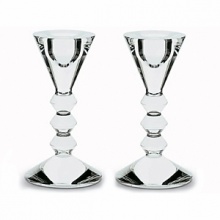 Fresh sculpted design comprising sharp edges and smooth planes. Their beauty is striking enough to stand alone, yet richly enhanced with the warm glow of candles. 5 3/8H vega candlestick, pair. Also available: 10 5/8H vega candlestick, each. Fresh sculpted design comprising sharp edges and smooth planes. Their beauty is striking enough to stand alone, yet richly enhanced with the warm glow of candles. 5 3/8H vega candlestick, pair. Also available: 10 5/8H vega candlestick, each.