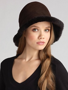 Soft and warm shearling fleece inside, naturally weather-resistant sheepskin outside makes this a stylish choice whatever the weather! Crown, about 22½ diameter Dyed Spanish shearling; dry clean Made in USA Fur origin: Spain 