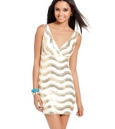 Sequins spread in metallic waves across this hot mini dress from As U Wish! For a look that's party-perfect, pair the dress with colorful accessories!