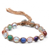 Chan Luu wraps up the boho luxe look with this leather bracelet, accented by a free-spirited mix of chunky colored crystals and multi colored stones.