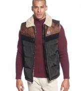 A puffer vest with a touch of cowboy style: Sean John down vest with contrast yoke and shearling-look collar and lining.