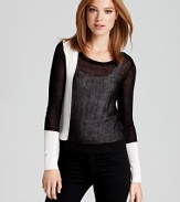 A bold black-and-white color scheme lends a graphic punch to this BCBGMAXAZRIA sweater.