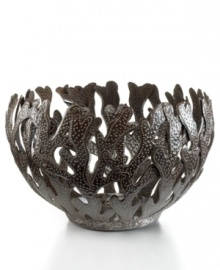 Made entirely of recycled steel, the Coral bowl is intricately cut and hammered by Haitian metal artisans to evoke the life-giving sea that laps their shores. Rich texture in its crisscrossed branches add to the special nature of each handmade piece. Made entirely of recycled steel, the Coral bowl is intricately cut and hammered by Haitian metal artisans to evoke the life-giving sea that laps their shores. Rich texture in its crisscrossed branches add to the special nature of each handmade piece.