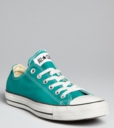 Classic Converse All Star sneakers are especially of-the-moment in the season's ultra-trendy jewel tones.