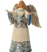 Full of great joy, this angel welcomes the Christmas spirit into your home. While striking blue and silver hues dance across her robe & wings, her calm expression & peaceful countenance create an undeniable warmth.
