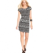 Designed in a sophisticated black and white palette, a slinky dress from Vince Camuto takes a contemporary turn with an allover graphic print. Strappy heels effortlessly transition the look from work to weekend.
