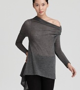Rendered in lightweight wool, this sheer Donna Karan New York turtleneck tunic flaunts a flared body and asymmetric hem for a modern take on a classic style. Effortless with leggings for the weekend or a pencil skirt for workdays, it's your new versatile go-to.