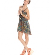Material Girl joins a lively print with trend-right, asymmetrical design -- and produces a technicolor dress that's perfect for strolling the streets of your favorite destination!