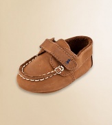 Classic leather boat shoe sets a fashionable course for the little one. Grip tape strap Topstitched trim Crazy horse leather; spot clean Imported