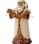 Santa has the golden touch. Dressing up in burgundy and golden hues, Santa takes a moment to decorate your home with a string of festive garland.