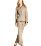 Le Suit gets chic for fall with an autumnal herringbone tweed suit. The accompanying printed scarf adds a modern touch to this timeless look.