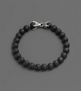 A versatile look that matches any ensemble, is laced with matte onyx beads and joined together by a sterling silver chevron clasp.Sterling silver chevron clasp8 mm beadsAbout 8½ longImported