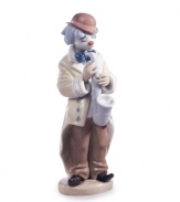 What a clown. The Sad Sax figurine from Lladro gets ready to play the blues, featuring a lavender saxophone and look of true sorrow in his painted frown face.