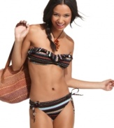 Make an impression at the beach! Roxy's brief bottom rocks a trendy tribal print and sexy side ties.