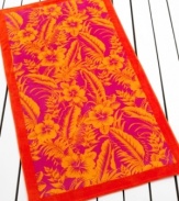 A bold pattern of tropical flowers is framed by a solid border in this beach towel from Lauren by Ralph Lauren, featuring a sizzling palette of orange, yellow and pink.