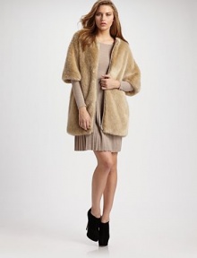 Plush faux-fur style can be perfectly paired over your favorite pleated dress or skinny jeans. Front zipper Three-quarter sleeves Fully lined About 27 from shoulder to hem 85% modacrylic/15% polyester trim 50% acrylic/20% wool/25% polyester/5% nylon Dry clean Imported