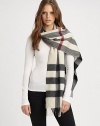 A beautiful cashmere style with an signature print and fringe details. CashmereAbout 14 X 79Dry cleanImported 