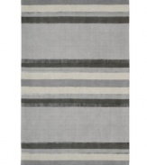 Linear designs are accented with exotic faux silk to create a timeless palette in the Sahara area rug from Calvin Klein. Crafted by skilled artisans in India, it features generously thick wool and viscose fibers woven to create remarkable strength and impeccable elegance.