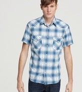 Classic Western styling meets detailed tailoring and an allover plaid design in this cowboy cool short-sleeve button-down from Lucky Brand.