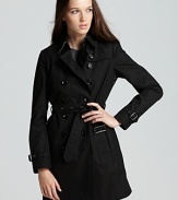 The classic Burberry Brit trench coat gains cold-weather credo with an inner warmer for a cozy yet chic approach to the rainiest of days.