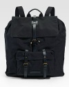 A utility design with city sophistication in rugged cotton canvas. A roomy, hold-everything backpack is finished with leather straps that hold everything together. Adjustable shoulder straps Top handle Drawstring closure Exterior front pocket Interior zip pocket Cotton 18W X 20½H X 5½D Imported 