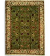 Inspired by 18th-century Persian tapestries, this rug features a vinery trellis motif in a lush palette of color that includes spice reds, soft blues and warm browns. A distinctive border of flowering shrubs and cypresses perfectly frames the rich color shadings of the sage green ground. Each color is individually skein-dyed for jewel-tone clarity and stunning depth. A patented luster wash imparts a vintage finish faithful to the craftsmanship of the original.