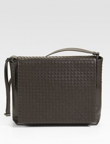 Classic crossbody design crafted in iconic smooth woven leather.Flap closureAdjustable shoulder strapInterior zip, cell phone and PDA pocketFully lined19½W x 12¼H x 5¼DMade in Italy