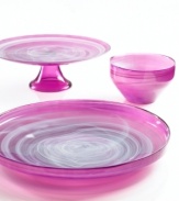 Adding a fun shock of color to modern settings, the small Sweet Plum bowl from Sea Glasbruk pairs luminous violet with swirls of white in handcrafted glass.