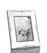 The stylized florals of Modern Love branch out on this gleaming silver-plated picture frame by Monique Lhuillier for Royal Doulton. A timeless balance of refinement and whimsy keeps memories fresh.