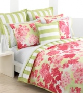 This breezy bedding design from Tommy Hilfiger features clustered hydrangeas in shades of vibrant coral over a watercolor green ground. Broad awning stripes on soft white shams and the duvet cover's reverse present classic, sophisticated style for your modern bedroom.