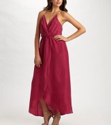 A bare and beautiful interpretation of the classic wrap gown in fluid silk.Crossover bodice front and back X-back spaghetti straps Elasticized waist Front crossover tulip skirt About 41 from natural waist Silk; dry clean Imported