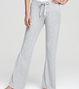 Lounge around in style and comfort. Juicy Couture's drawstring pants in soft fabric with lace detail.