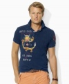 Faded and abraded for a timeworn quality, a trim-fitting cotton mesh polo is accented with Asian-inspired embroidery for handsome international style.